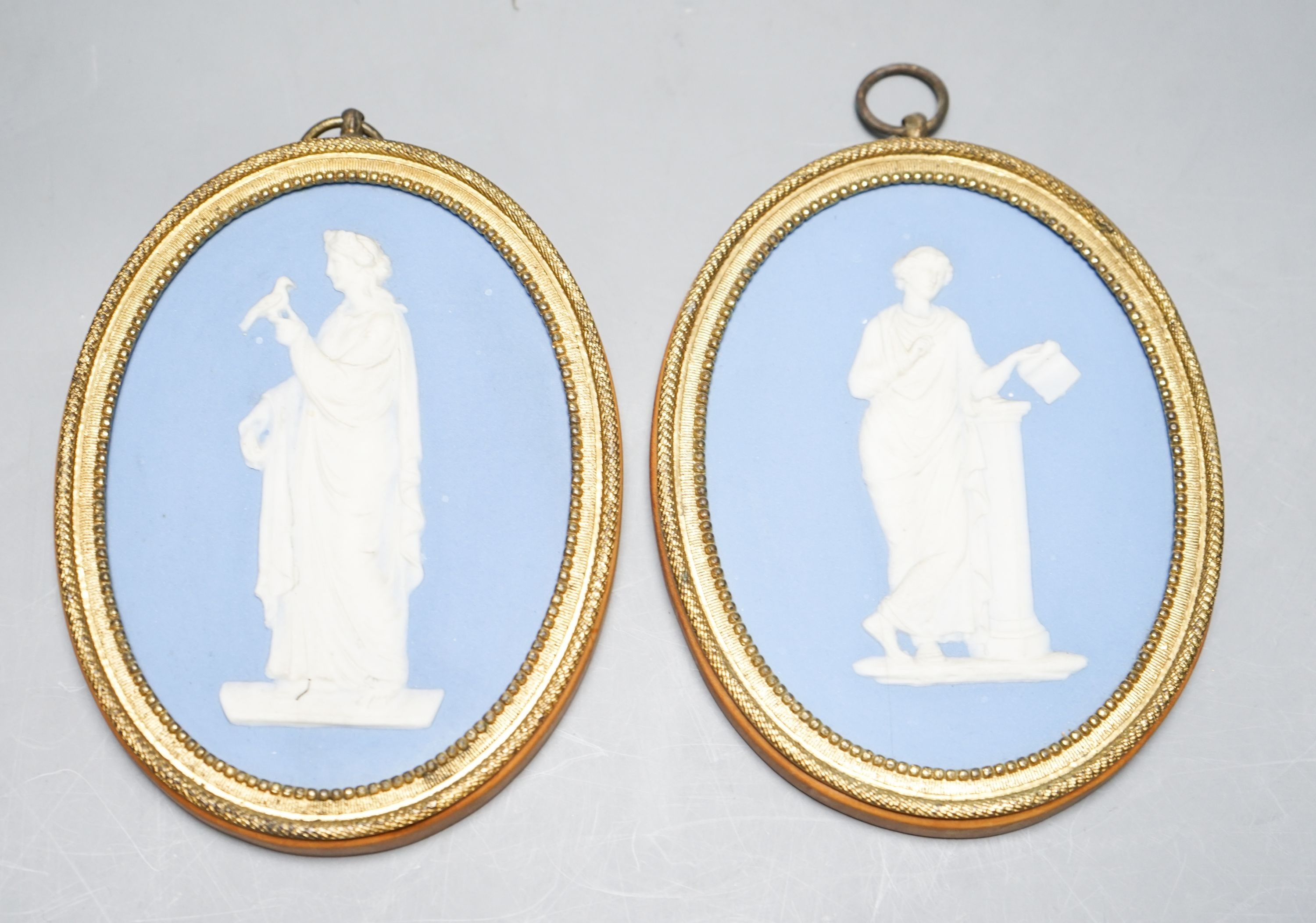 A pair of blue and white jasper oval miniature plaques, presumably Wedgwood, 16cm